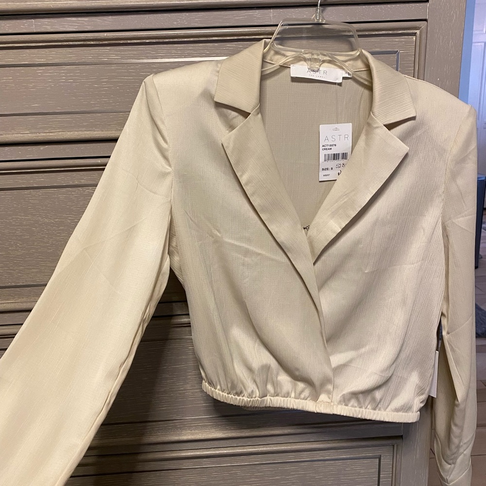 Brand new with all tags attached ASTR cream silk top size Small never worn